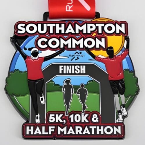 Finisher's medal with illustration of runners in a park. Text reads Southampton Common 5k, 10k & half marathon