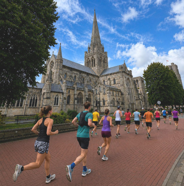 Group of runners going past Chichester Cathedral